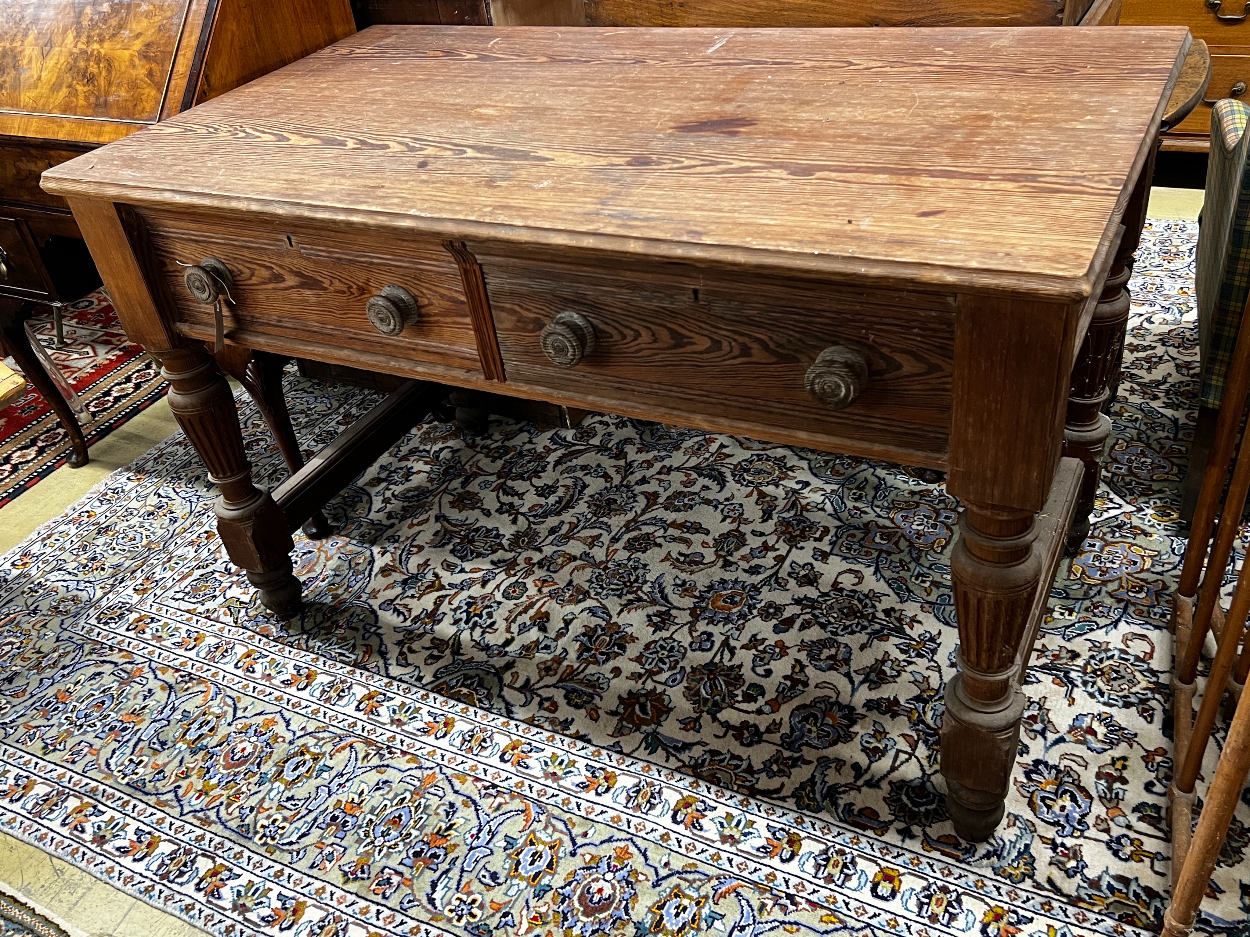 A Victorian stained pitch pine two drawer serving table by repute from Balmoral Castle kitchens, length 136cm, width 76cm, height 84cm